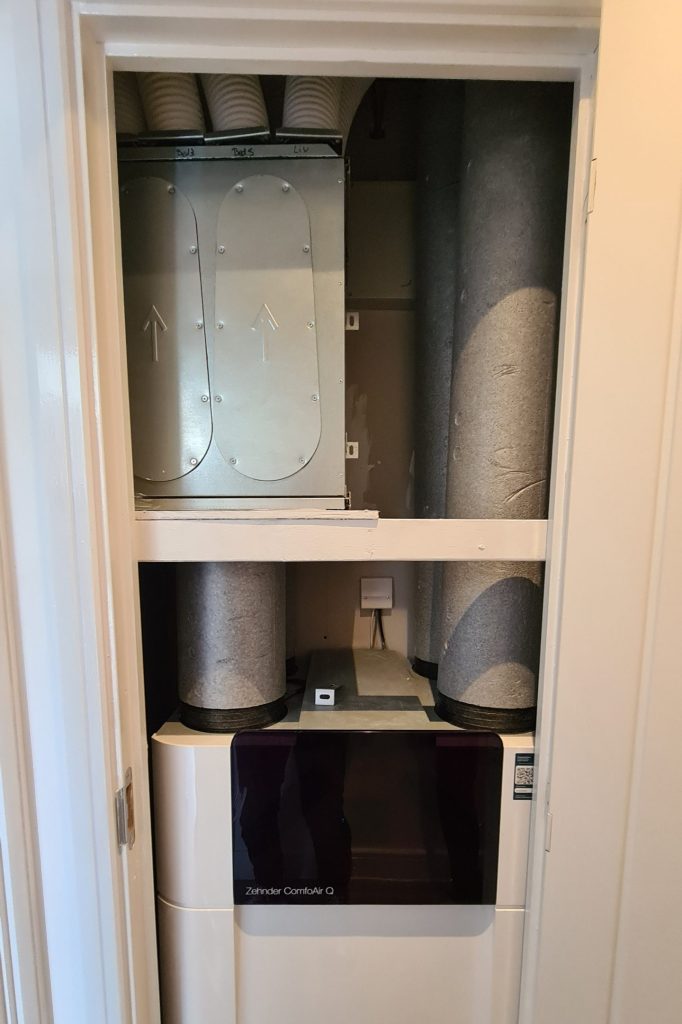 A centralised MVHR unit taking up cupboard space